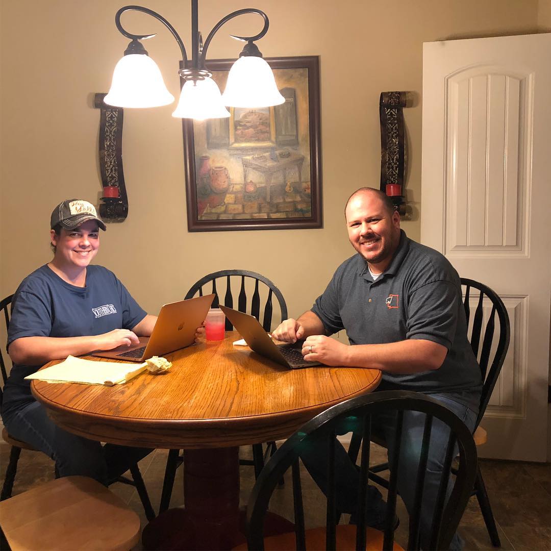 Nick and Heather working at the kitchen table in the early days